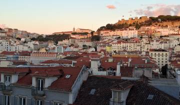 Cityscape view with historic buildings and a fort.