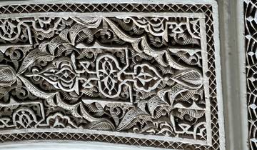 Close-up of intricate carvings on a wall.