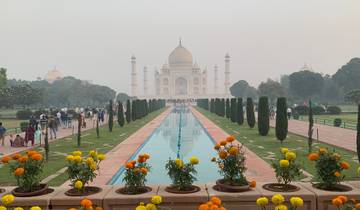 Taj Mahal view with a flower garden in the foreground.