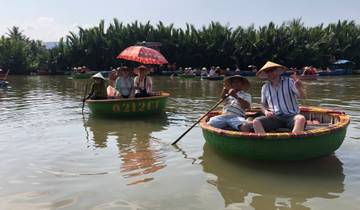 Tourists in round boats on a river.