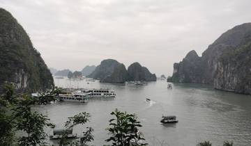 Scenic view of Halong Bay with boats and limestone islands.