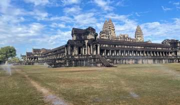 Wide-angle view of Angkor Wat with clear blue skies.