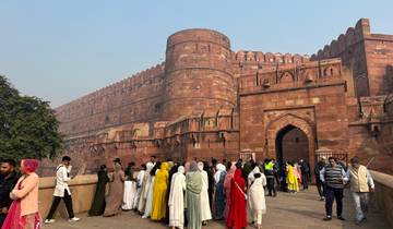 Agra Fort with people gathered outside the entrance.