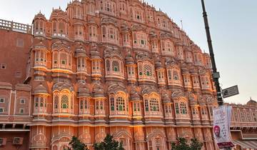 The Hawa Mahal illuminated at sunset.
