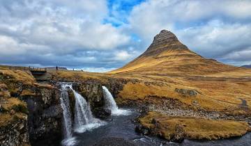 Iconic view of Kirkjufell mountain with a cascading waterfall.