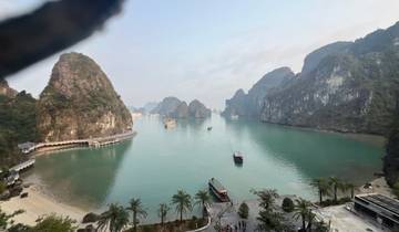 Beautiful view of Halong Bay with boats and limestone formations.