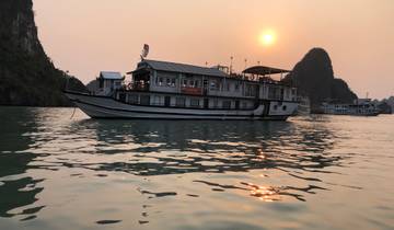 Boat sailing on the water during sunset.