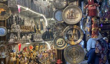 Market stall with various souvenirs and artifacts.