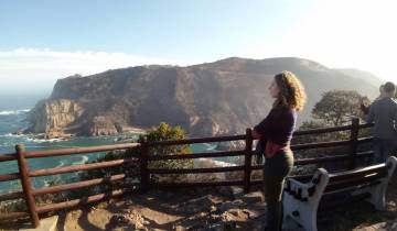 Woman looking at a coastal cliff view