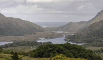 Scenic view of a valley with lakes between mountains.