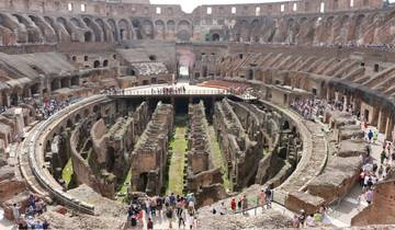 The interior of the Colosseum filled with tourists.