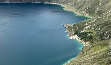 Quilotoa Crater Lake with green and blue waters surrounded by mountains.