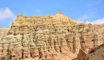 Eroded rock formations with sky backdrop.