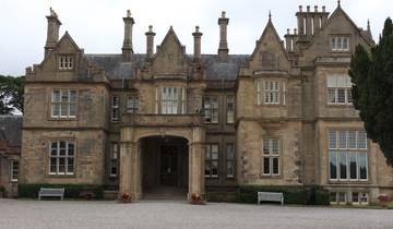 Historic building with multiple windows and a grand entrance.