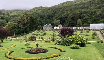 Expansive garden with ornate design and lush greenery.