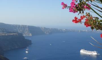 Scenic view of a cruise ship and coastline.