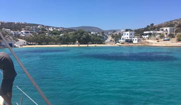 Coastal village with sandy beaches and clear blue water.