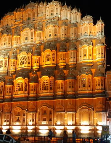 Hawa Mahal, the Palace of Winds, beautifully illuminated at night.