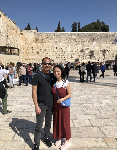 A pair of tourists at the Western Wall in Jerusalem.