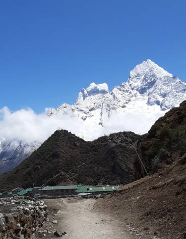 Snow-capped peaks with clouds.