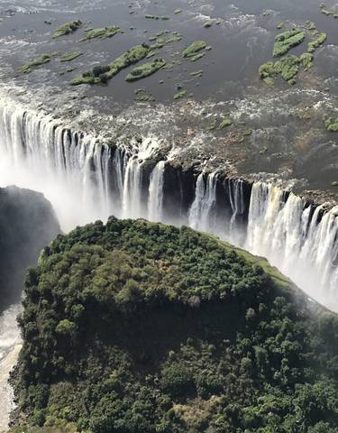 Aerial view of Victoria Falls with water cascading.
