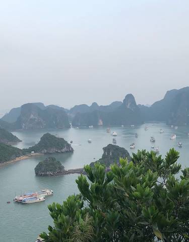 Aerial view of islands and boats on the water.