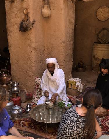 Man in traditional attire performing a ritual or ceremony.
