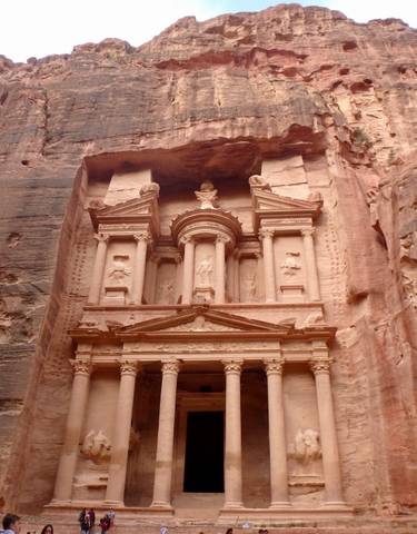 The Treasury at Petra with detailed carvings in the rock.