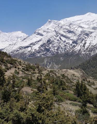 Expansive mountain panorama with snow