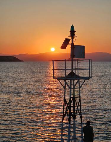 Sunset with a structure in the sea