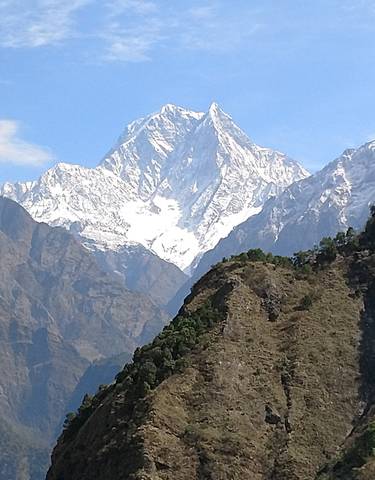 Snowy mountain peaks against a clear sky.