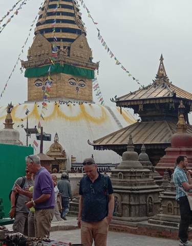 Large stupa with eyes, surrounded by smaller temple structures.