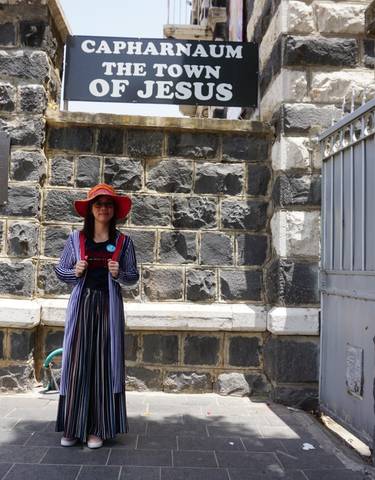 Person in traditional dress standing in Capernaum.