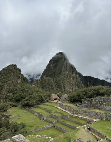 Iconic ruins with a mountain peak in the background.