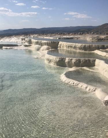 Beautiful terraced pools filled with clear water.