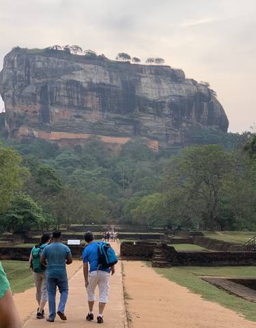 People walking towards Sigiriya rock.