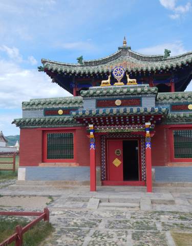 Traditional temple with colorful architecture and blue sky.