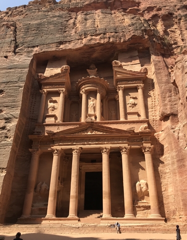 Ancient carved facade of Petra with intricate details.