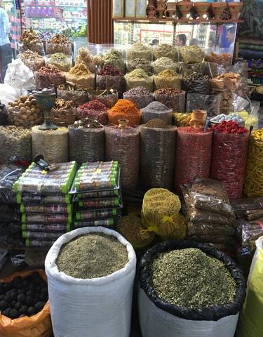 A market stall with various spices and condiments in display.