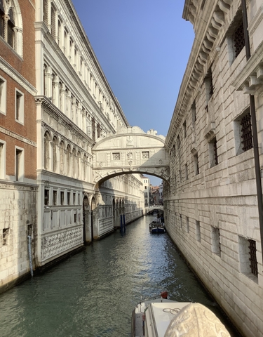 Bridge of Sighs across a canal in Venice.