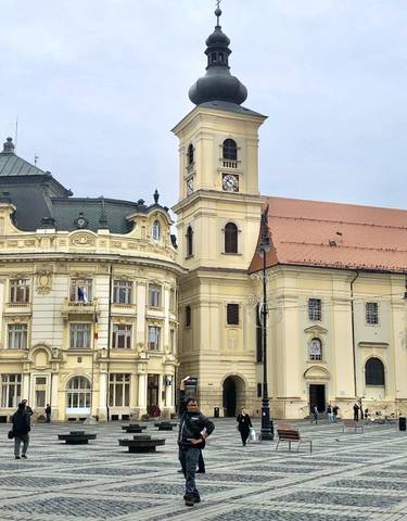 Historical buildings with intricate architecture and a clock tower.