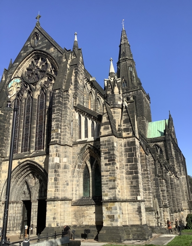 Gothic-style church with a clock and spires.