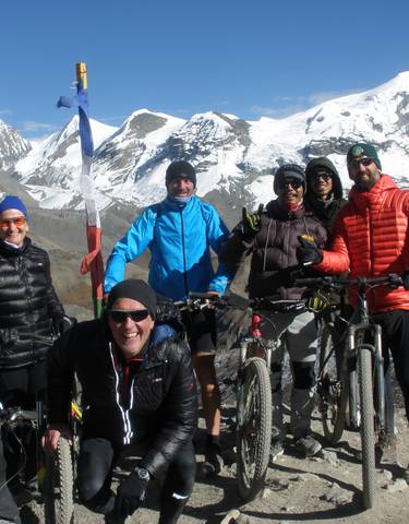 Group of cyclists at the Himalayas.