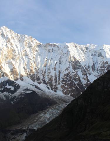 Snow-covered mountain range with clear skies.