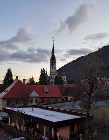 Beautiful sunset view over a town with a church steeple.