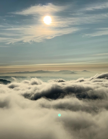 Spectacular cloud and mountain landscape from above.