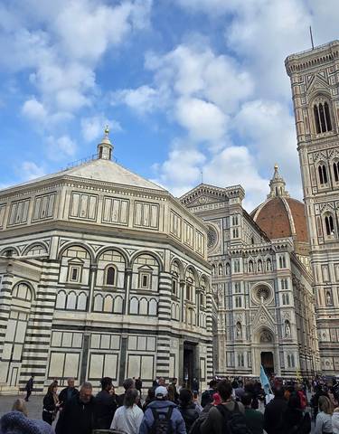 Florence Cathedral with many visitors in front.