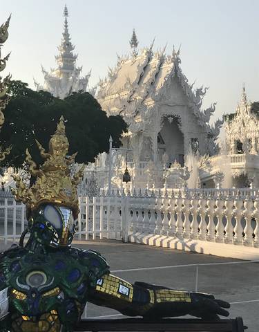 White temple structure with intricate designs.