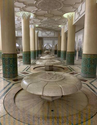 Interior view of a tiled bathhouse.