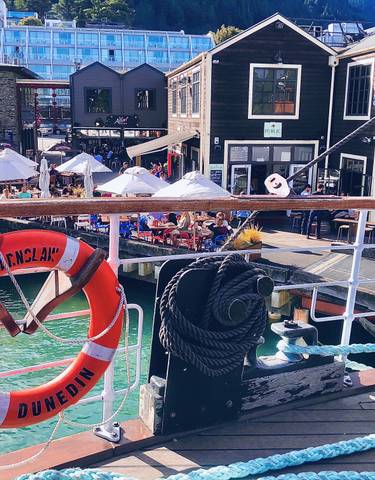 View from a boat showing harbor area with diners.